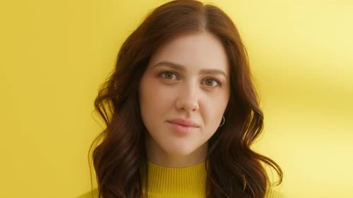 Young Woman Smiling Portrait with Yellow Background