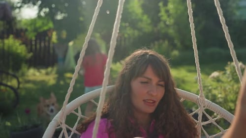 Reflective Woman Sits Peacefully With Book In Her Hands Contemplative Woman Leisurely Enjoying