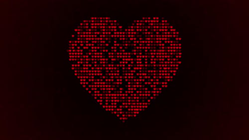 Red pixel heart on dark background symbol
