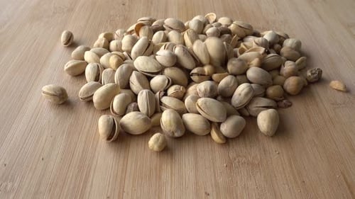 Food background. Falling Roasted pistachio nuts seed with shell close up. Dieting concept