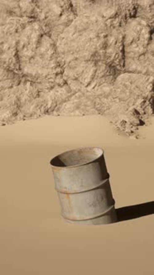 A Barrel Sitting in the Middle of a Desert