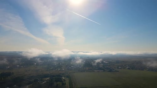 Top View From Above of Landscape Covered with Puffy Morning Fog Cold Humid Air Condensing in Rain