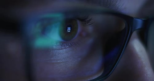 Macro of an Young Blond Successful Businesswoman with Glasses is Working with a Computer for Send