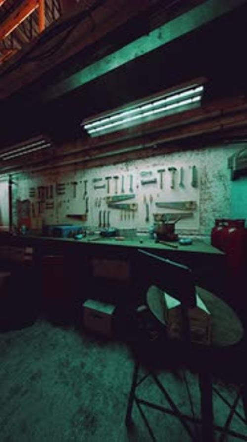Empty Workshop with Tools and Workbench Background
