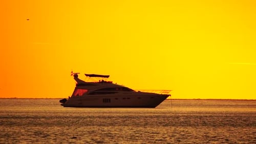 Luxury Yacht on the Ocean at Sunset