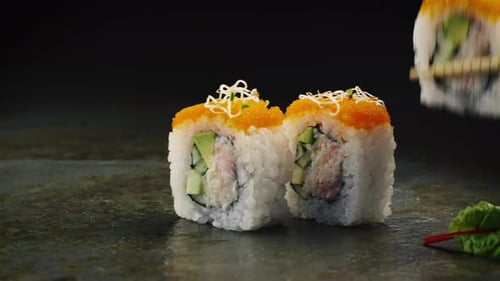 Eating Sushi in Japanese Restaurant. Close-up.