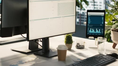 Modern Workspace with Analytical Data Dashboards Displayed on Devices