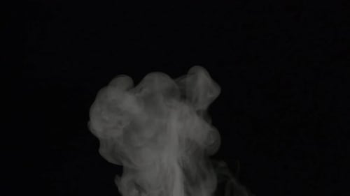 Billowing White Smoke Against a Black Background