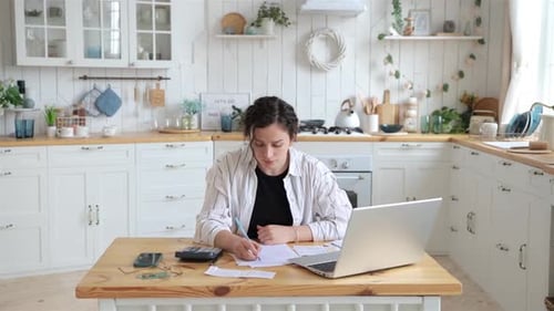 Stressresistant Woman Successfully Deals with Financial Documents Paying Utility Bills or Loans on