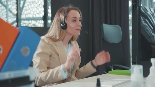 Cheerful Woman Video Conferencing in Modern Office