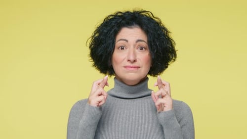 Woman Crossing Fingers for Luck and Success