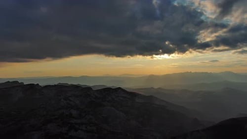 Sunset Over Mountain with Dramatic Clouds