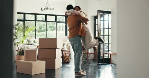 Loving Couple Celebrating Moving into New Home