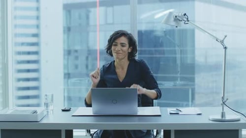 Woman Working at Desk in Modern Office