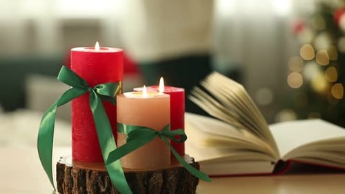 Festive Candles with Christmas Tree and Open Book