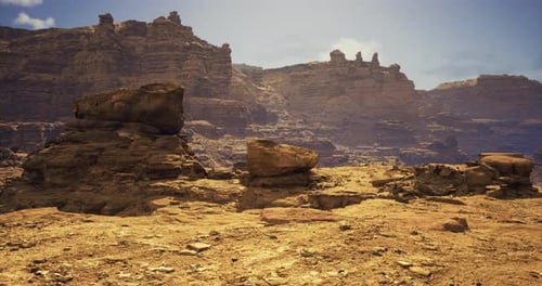 Majestic Rock Formations in a Vast Desert Landscape with Clear Skies