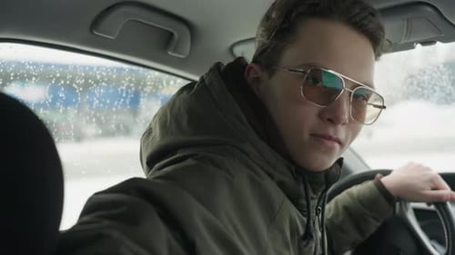 Young Adult in Car, Stylish Glasses