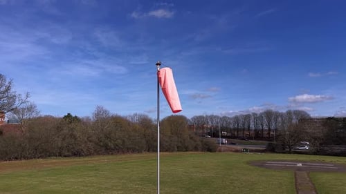 Windsock Waving in a Rural Landscape