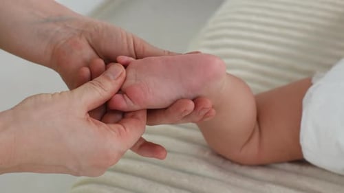Gentle Massage of a Baby's Tiny Foot