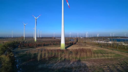 Wind turbines farm generating clean energy rural landscape. Perfect aerial view drone