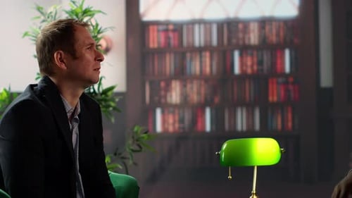 Businessmen Toasting with Whiskey in Office Setting