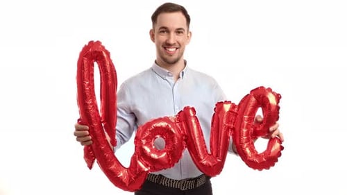 Man Holds Red Love Balloon Smiling