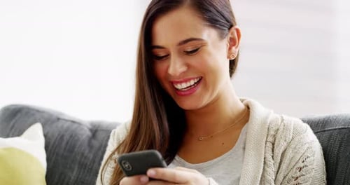 Woman, phone and laughing on sofa for funny social media post, reading mobile notification