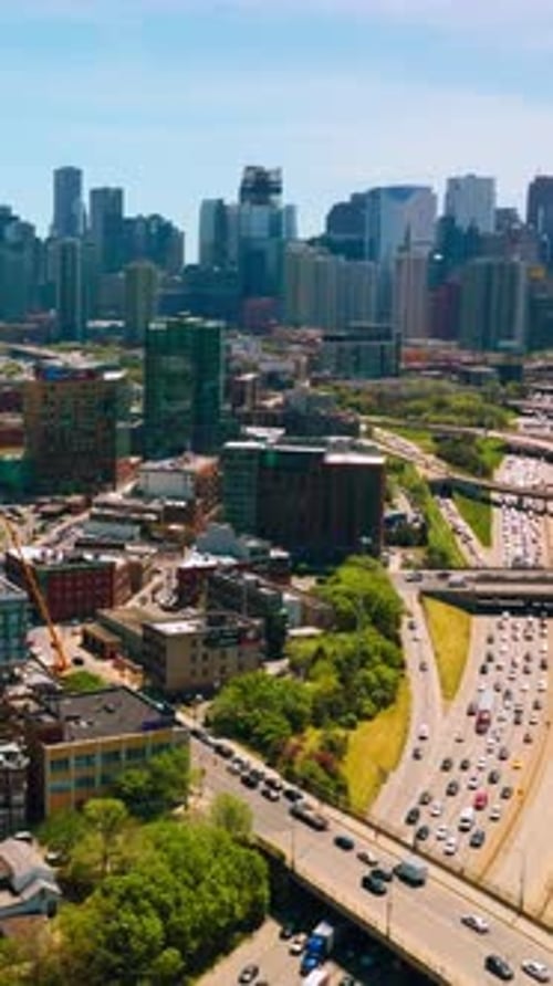 Broad multi-lane road going through the busy city. Bright and diverse architecture of Chicago