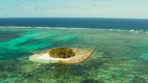 Tropical Guyam Island with a Sandy Beach and Tourists