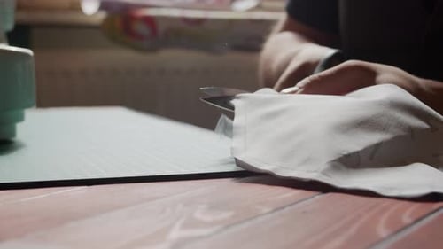 Young Adult Cutting Fabric for Sewing Project