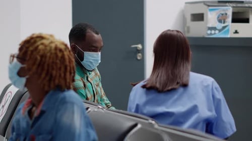 People Wearing Masks in Hospital Waiting Room