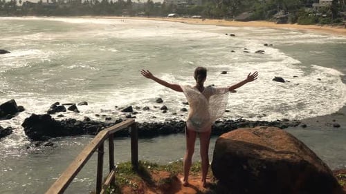 Woman With Wide Open Arms Standing Near Ocean, Super Slow Motion 240fps