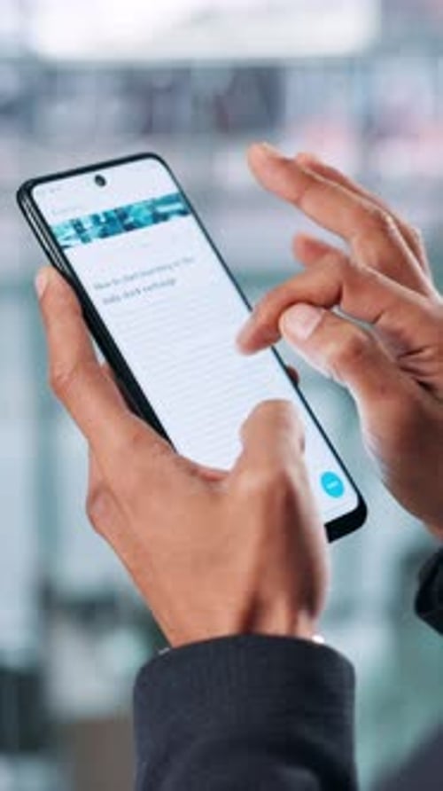 Hands Scrolling Smartphone for Investment Information