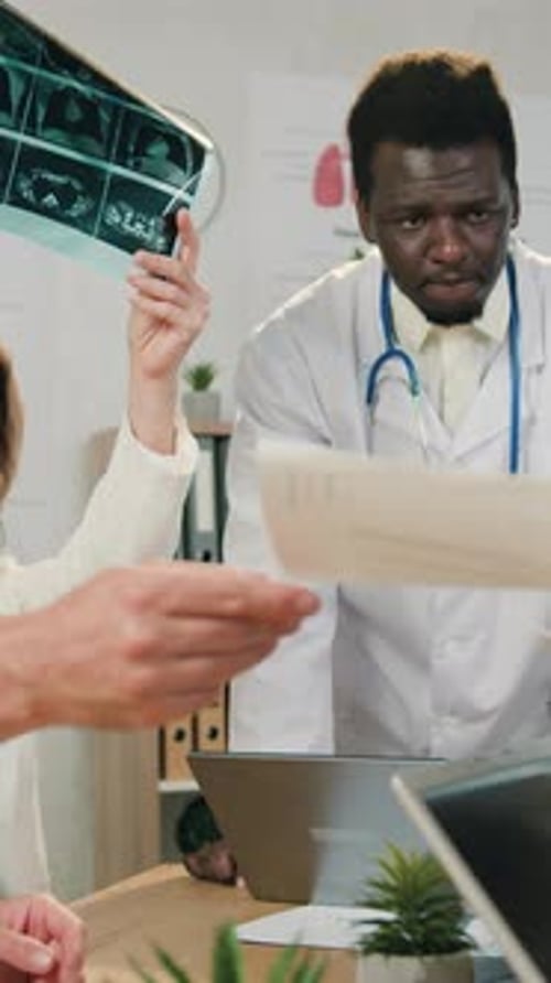 Close Up of Goodlooking Confident Purposeful Experienced Multiethnic Male and Female Doctors Which