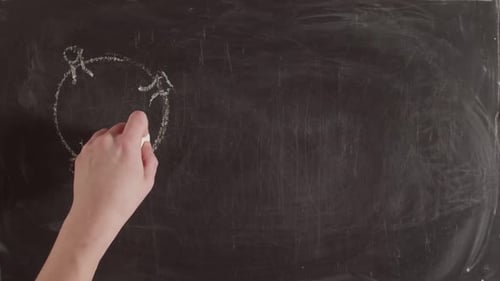 Term Covid19 is Written By Hand on a Chalkboard Next to Picture of the Covid Virus and a Graph with