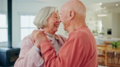 Senior Couple Dancing Happily in Their Home