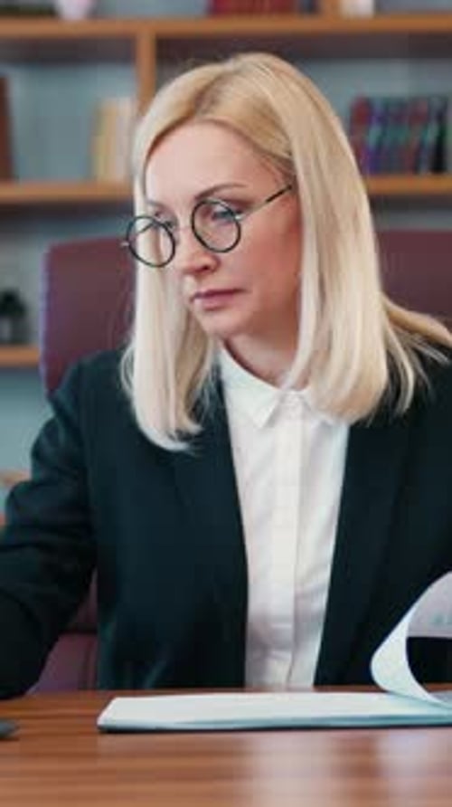 Business Concept Where Pretty Busy Skilled Adult Light Haired Female Office Manager in Black Jacket