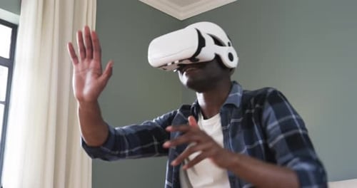 Young Adult Using Virtual Reality Headset at Home