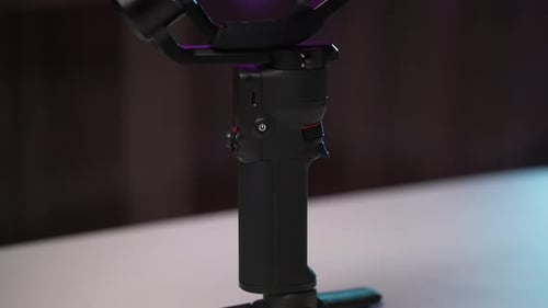 Rotating Camera Gimbal on Dark Background with Lighting