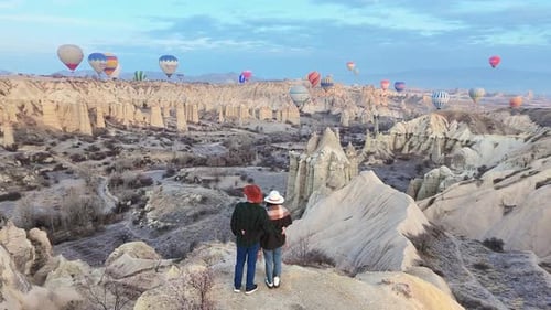 Couple Enjoy Hot Air Balloon Panorama In Love Valley