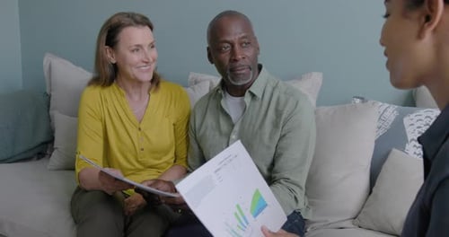 Mature Couple Meeting with Consultant at Home