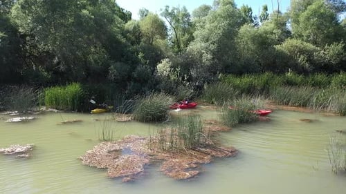 Sportsmans Canoeing On The River With Aerial View