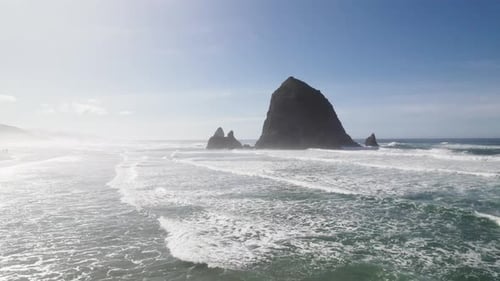 Foggy mountains meet the sea at Cannon Beach