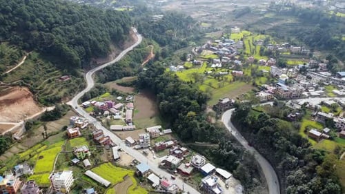 A beautiful aerial view of the small town of Dakshinkali, Nepal surrounded by mustard fields and the