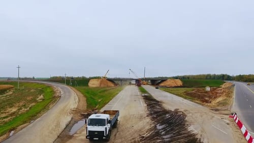 Bridge Construction Over Highway. Drone View of Suburban Road Construction. Aerial View