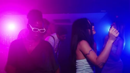 Enthusiastic Young Adults Dancing at a Party