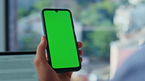 Businessman Finger Tapping Chroma Key Cellphone Browsing at Workplace Closeup