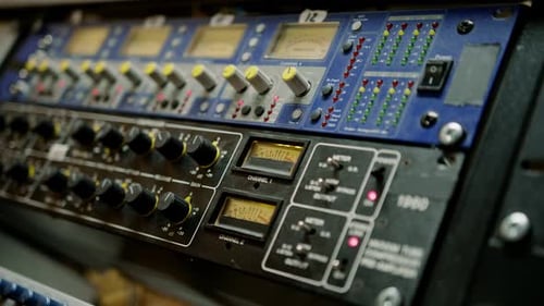 old displays of professional analog volume meters in a recording studio measuring and showing