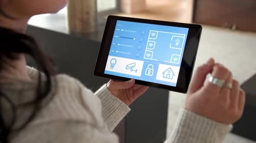 Woman Controls Smart Home With Tablet Close Up