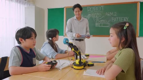 Group of students learning in a robotics class at elementary school.